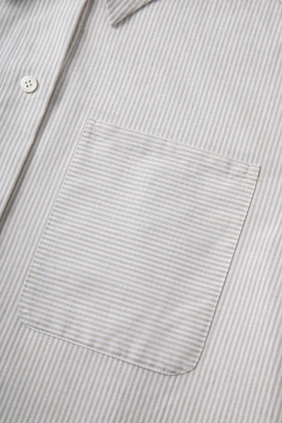 The French-style dress features a fitted long-length design Tracymade