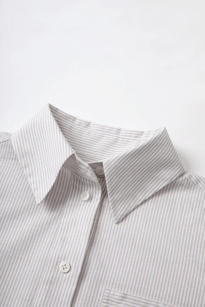 The French-style dress features a fitted long-length design Tracymade