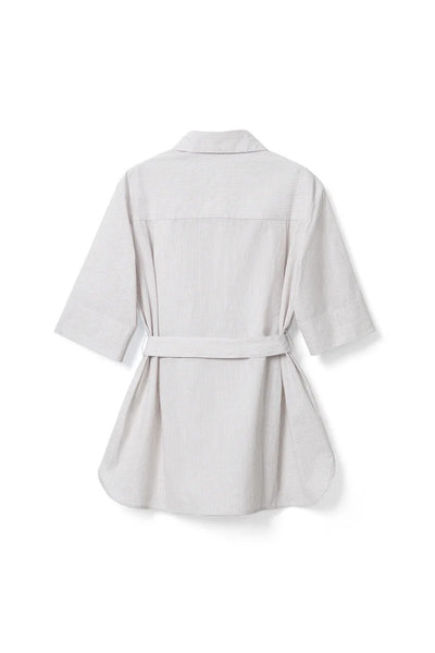 The French-style dress features a fitted long-length design Tracymade