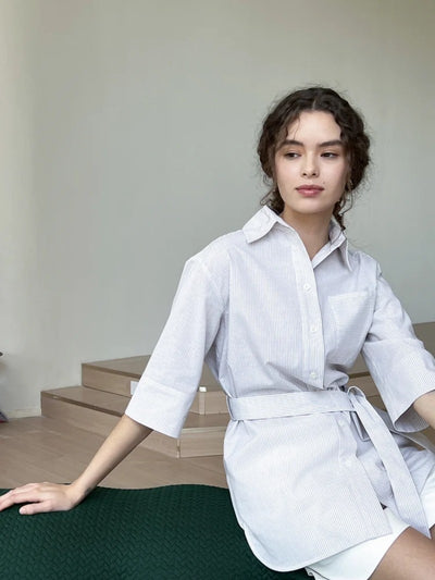 The French-style dress features a fitted long-length design Tracymade